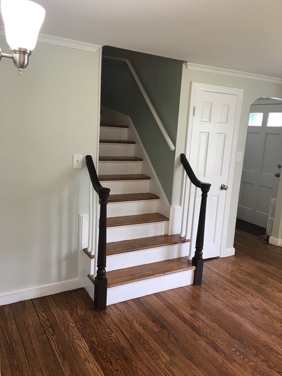 1330 Bradley Road Springfield, MA 01118 - Photo 17 of 29 a view of entryway with wooden floor and stairs