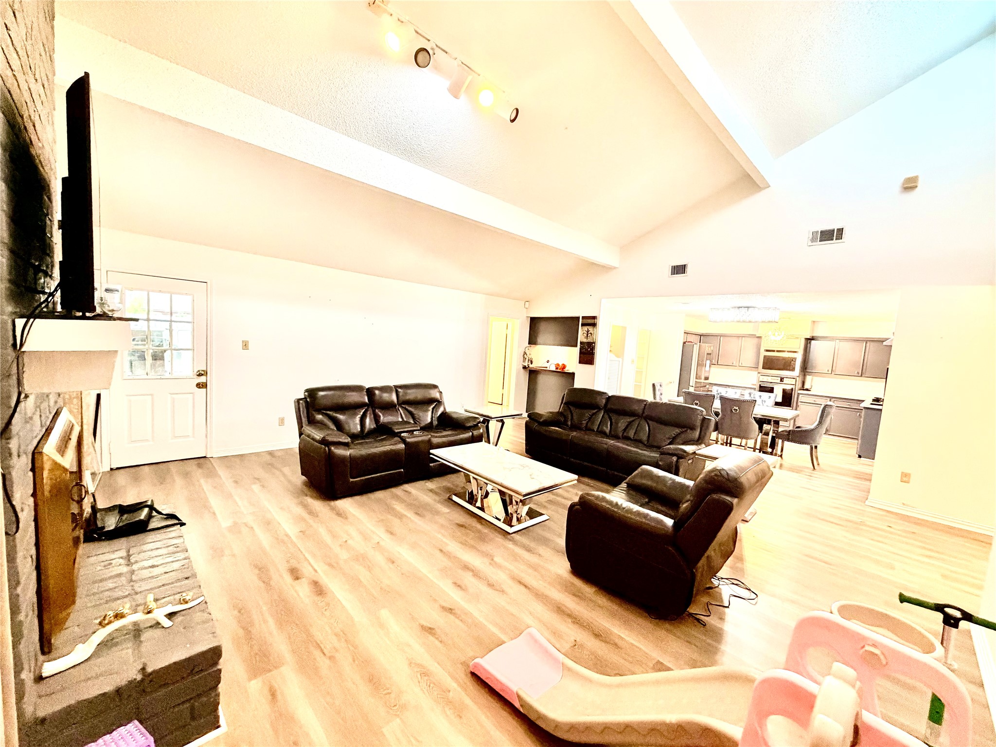 11635 Ridge Run Drive Houston, TX 77064 - Photo 5 of 20 a living room with furniture a flat screen tv and a refrigerator