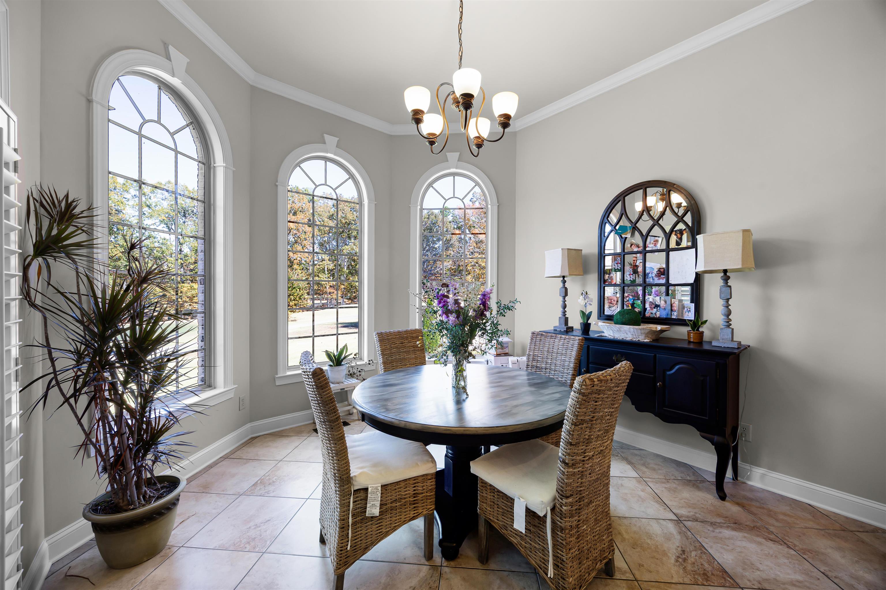 140 Legends Drive Counce, TN 38326 - Photo 13 of 30 Dining area featuring crown molding, a chandelier, and light tile patterned floors