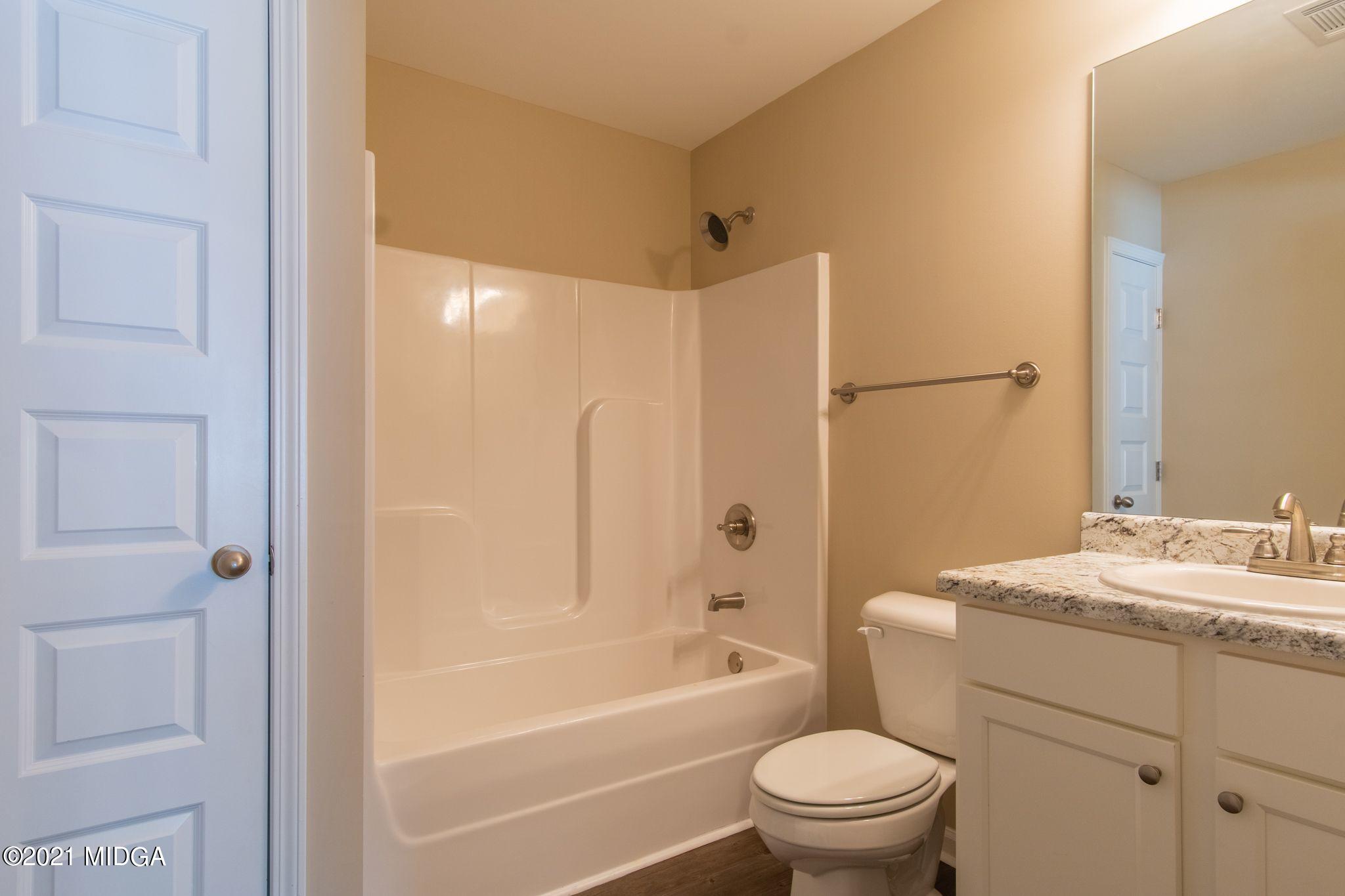 333 Pond View Road Macon, GA 31206 - Photo 15 of 22 a bathroom with a sink toilet and shower