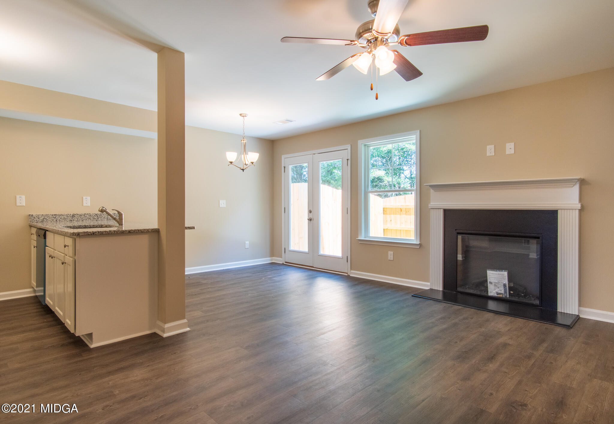 333 Pond View Road Macon, GA 31206 - Photo 3 of 22 a view of an empty room with a fireplace and a window