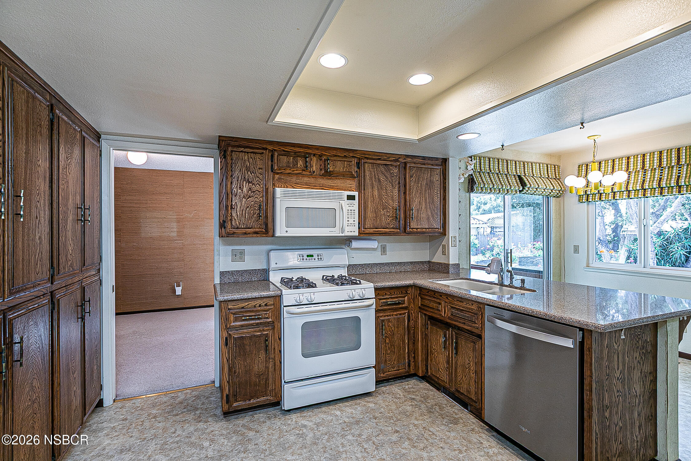 1260 Onstott Road Lompoc, CA 93436 - Photo 15 of 52 a kitchen with a stove sink and refrigerator