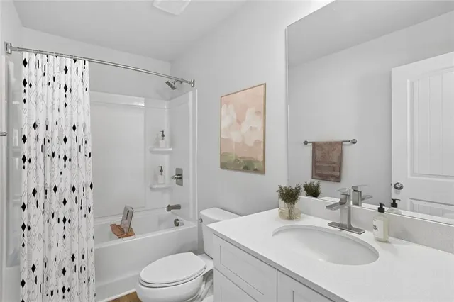 a bathroom with a sink toilet a shower and a mirror