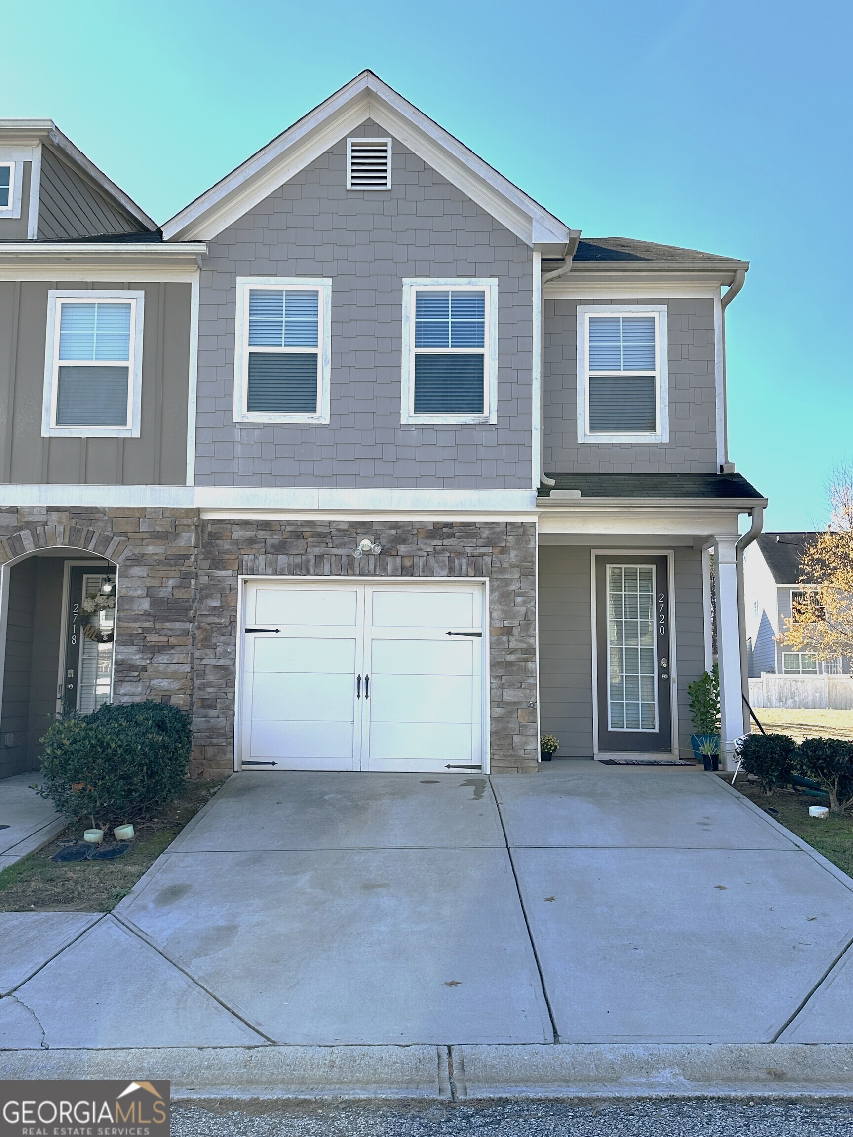 2720 Avanti Way Decatur, GA 30035 - Photo 1 of 1 a front view of a house with a yard and garage