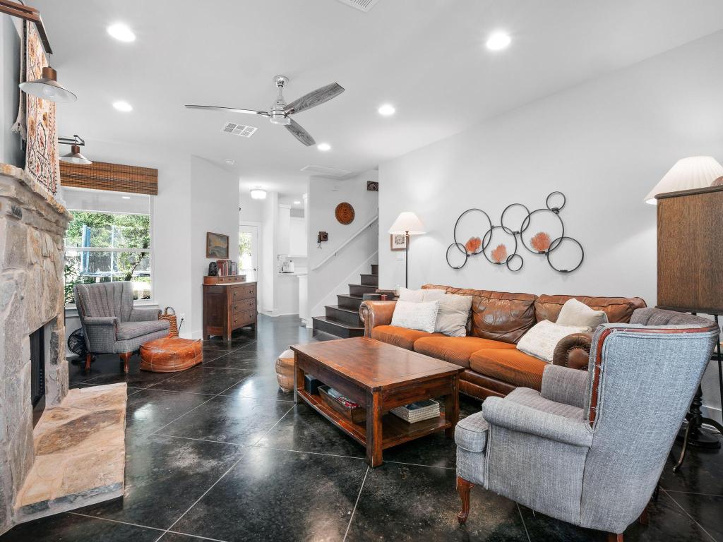 10103 Twin Lake Loop Dripping Springs, TX 78620 - Photo 8 of 32 Living room with ceiling fan, recessed lighting, stairs, a fireplace, and granite tiled floors