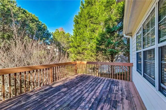 a view of a yard with wooden fence