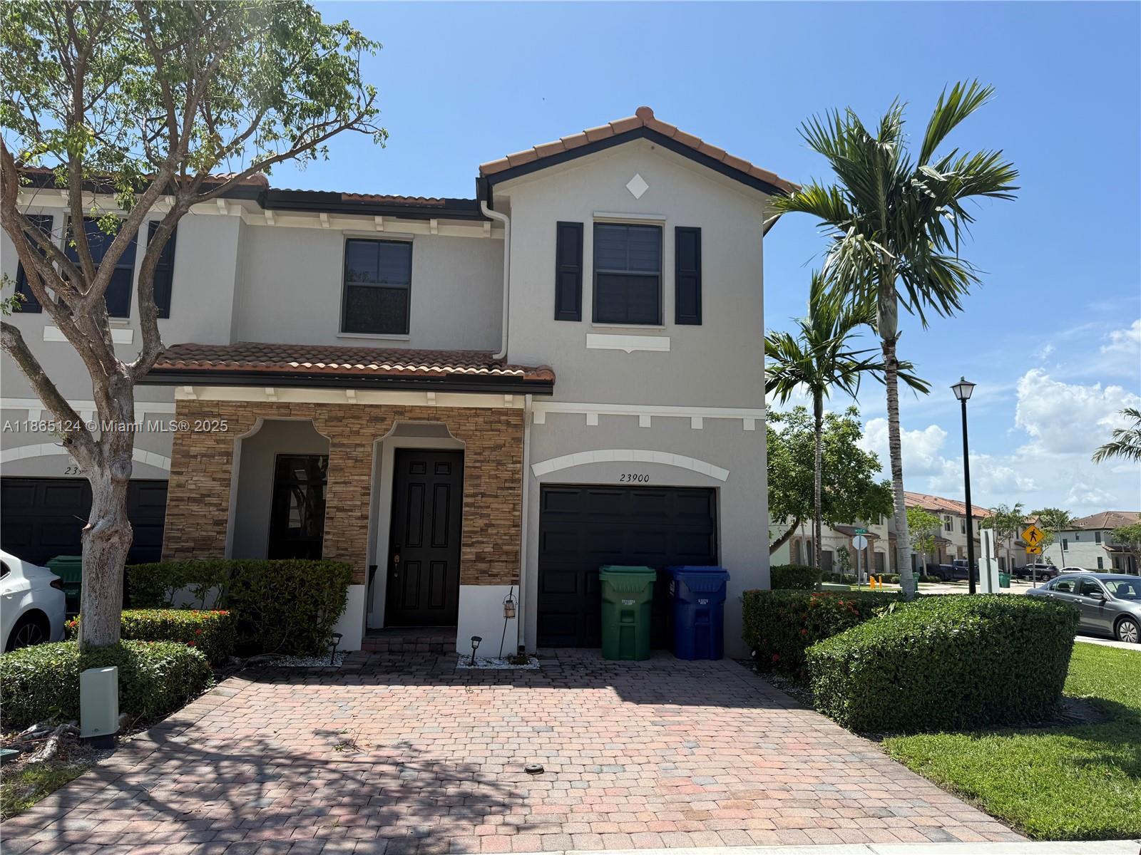 a front view of a house with yard