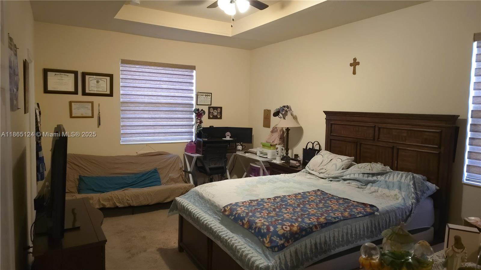 23900 Southwest 117th Court Homestead, FL 33032 - Photo 12 of 24 a bedroom with a bed and window