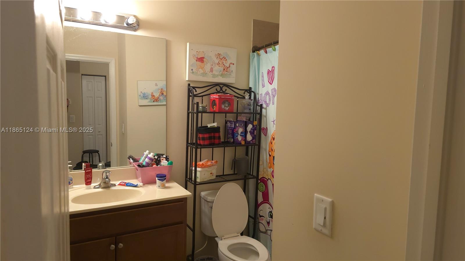 23900 Southwest 117th Court Homestead, FL 33032 - Photo 20 of 24 a bathroom with a sink toilet and a mirror