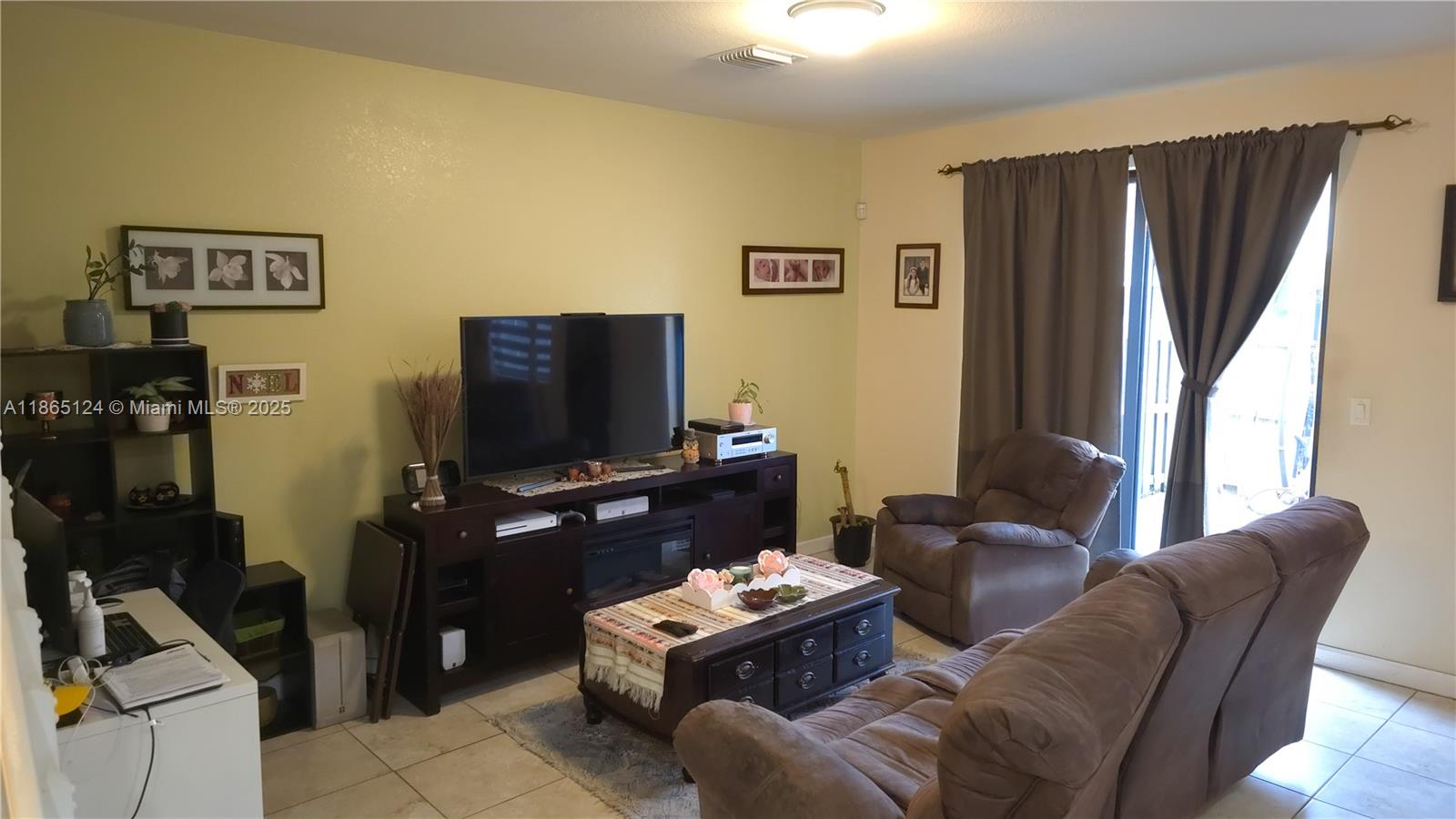23900 Southwest 117th Court Homestead, FL 33032 - Photo 7 of 24 a living room with furniture and a flat screen tv