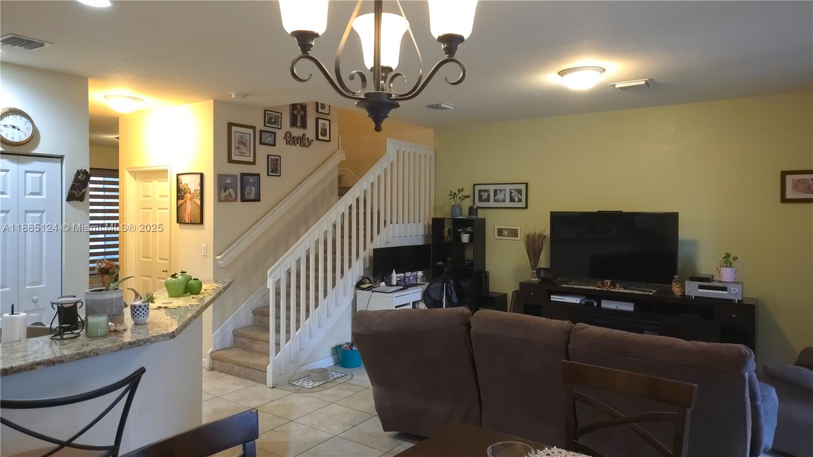 23900 Southwest 117th Court Homestead, FL 33032 - Photo 8 of 24 a living room with furniture and a flat screen tv