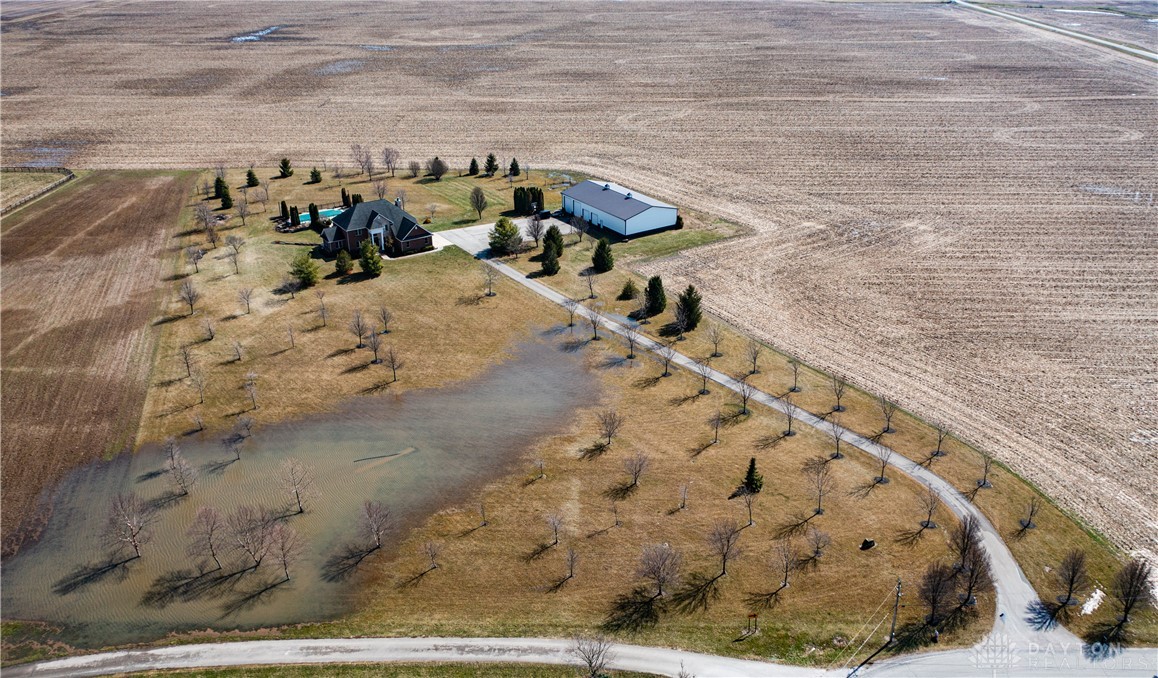 1 Hornbeam Road, Unit 1 Sabina, OH 45169 - Photo 6 of 7 An expansive rural property features a residence, large outbuilding, and a private pool.