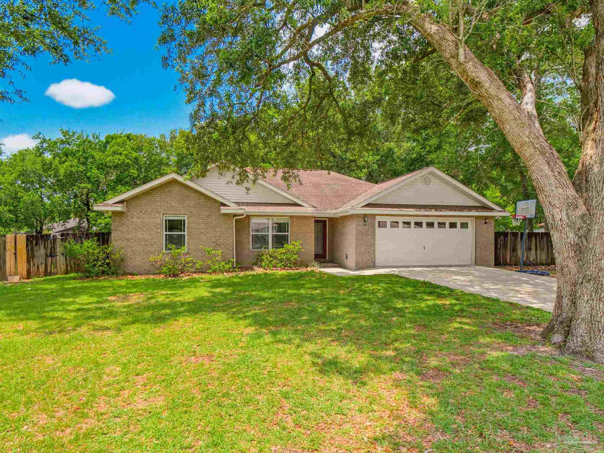 5567 Jones Street Milton, FL 32570 - Photo 3 of 48 a view of a house with a yard