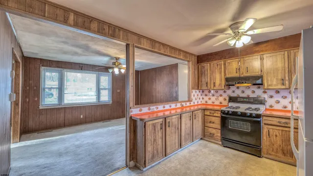 a kitchen that has a stove and a sink