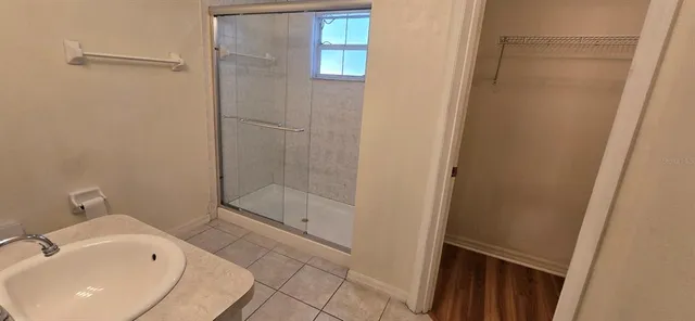 a bathroom with a sink and a shower