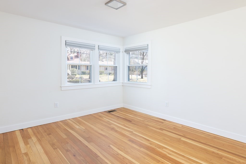 34 Fairbanks Road Lexington, MA 02421 - Photo 17 of 36 a view of empty room with wooden floor and fan