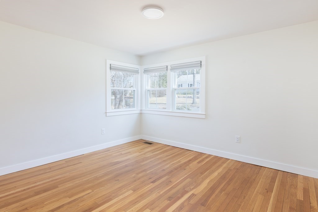 34 Fairbanks Road Lexington, MA 02421 - Photo 18 of 36 an empty room with wooden floor and windows
