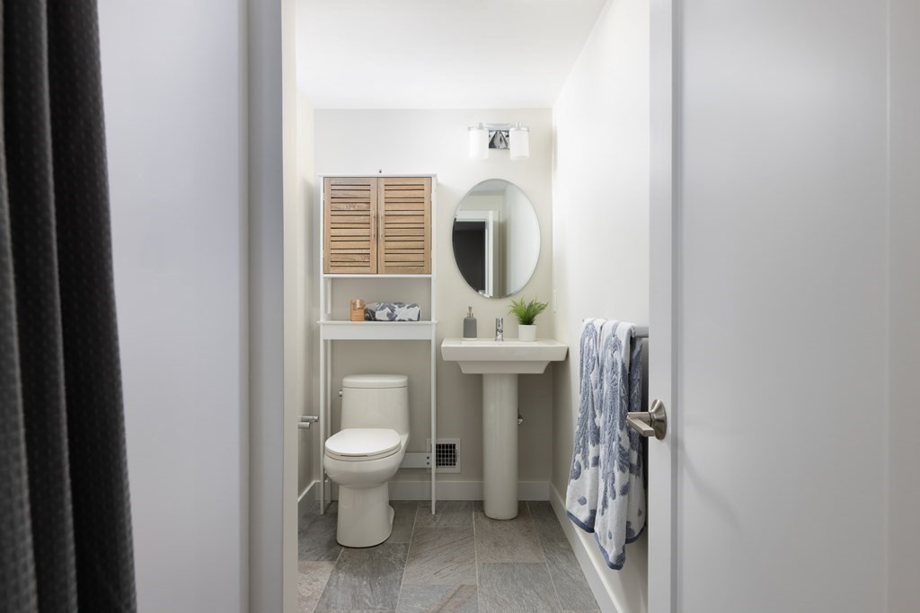 34 Fairbanks Road Lexington, MA 02421 - Photo 23 of 36 a bathroom with a toilet sink and mirror