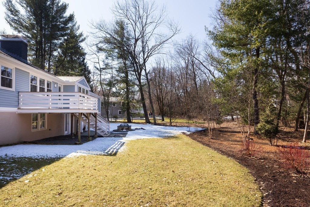 34 Fairbanks Road Lexington, MA 02421 - Photo 28 of 36 a view of swimming pool with outdoor seating and trees in the background