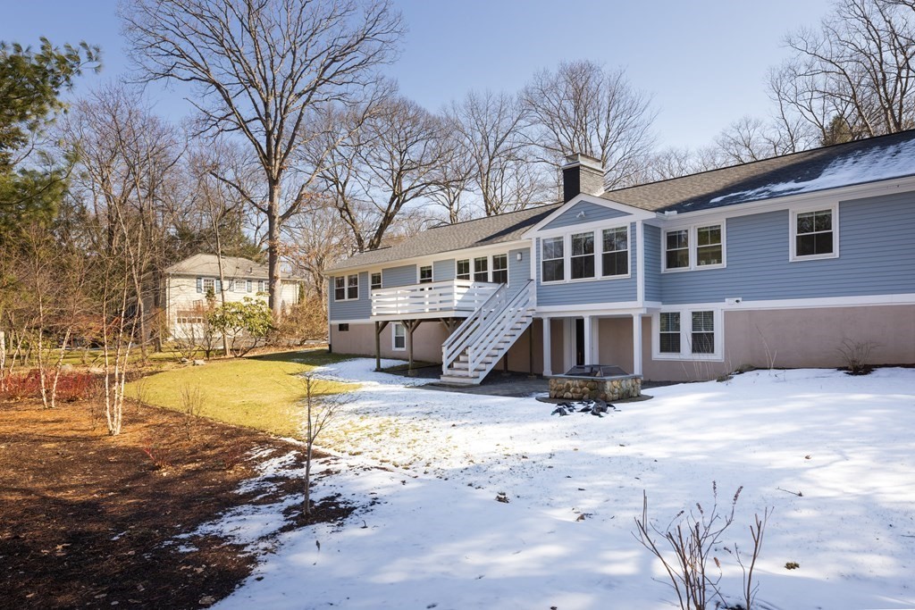 34 Fairbanks Road Lexington, MA 02421 - Photo 31 of 36 a view of a house with a yard covered in snow