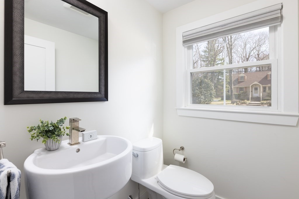 34 Fairbanks Road Lexington, MA 02421 - Photo 10 of 36 a bathroom with a sink and a mirror