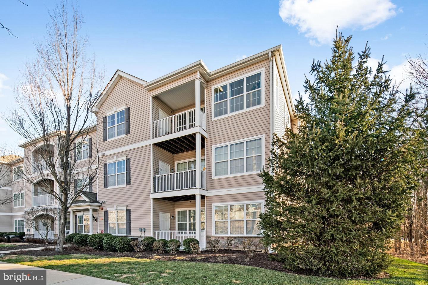 a front view of a building with garden