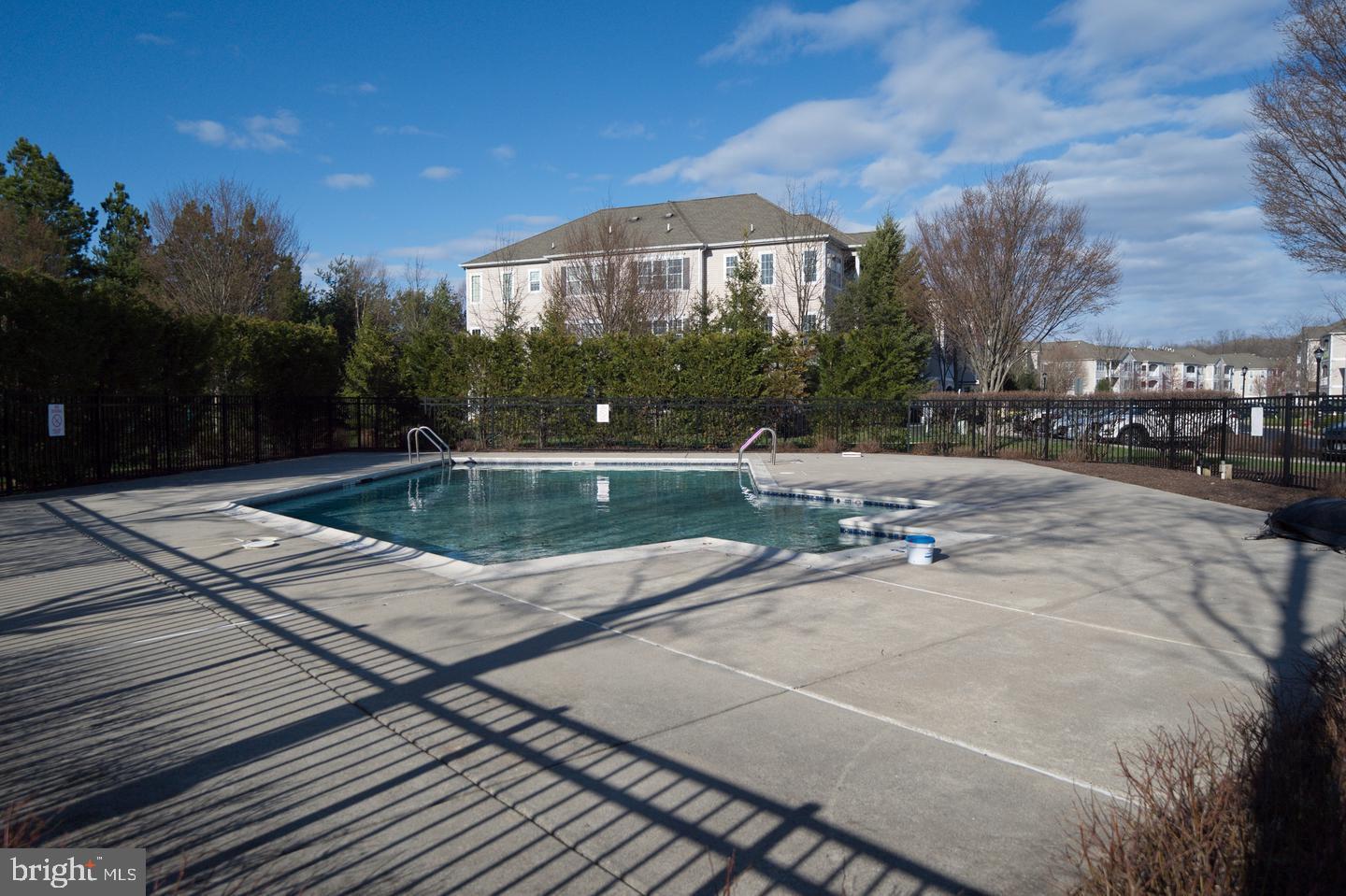 1028 Timberlake Drive Ewing, NJ 08618 - Photo 8 of 10 a view of a swimming pool with a yard
