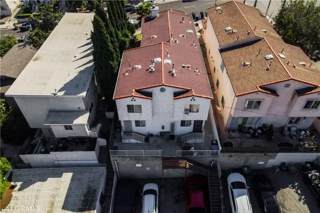 an aerial view of buildings with yard