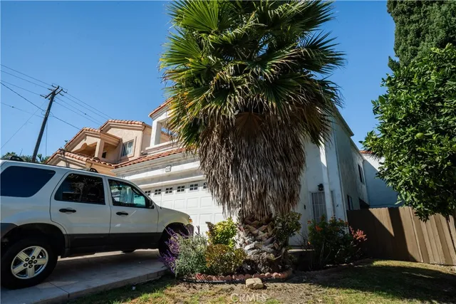 a view of a car in front of a house