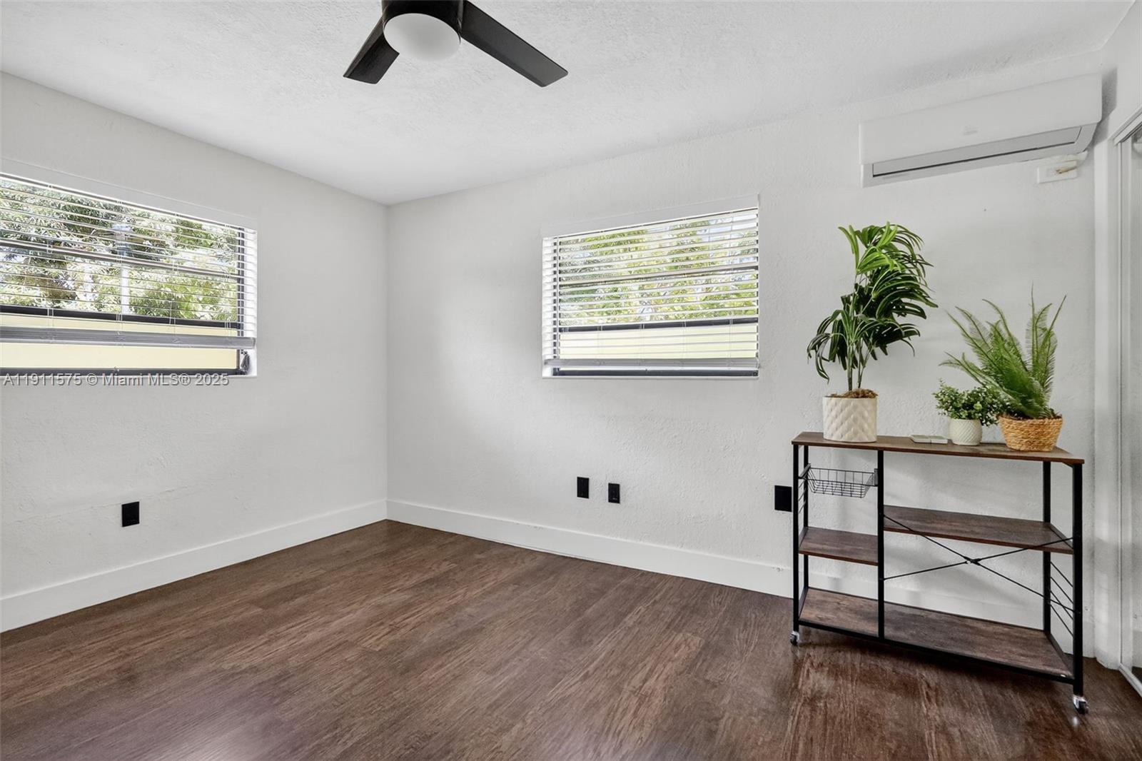 765 Northwest 46th Street Miami, FL 33127 - Photo 30 of 40 a view of room with hardwood floor and window