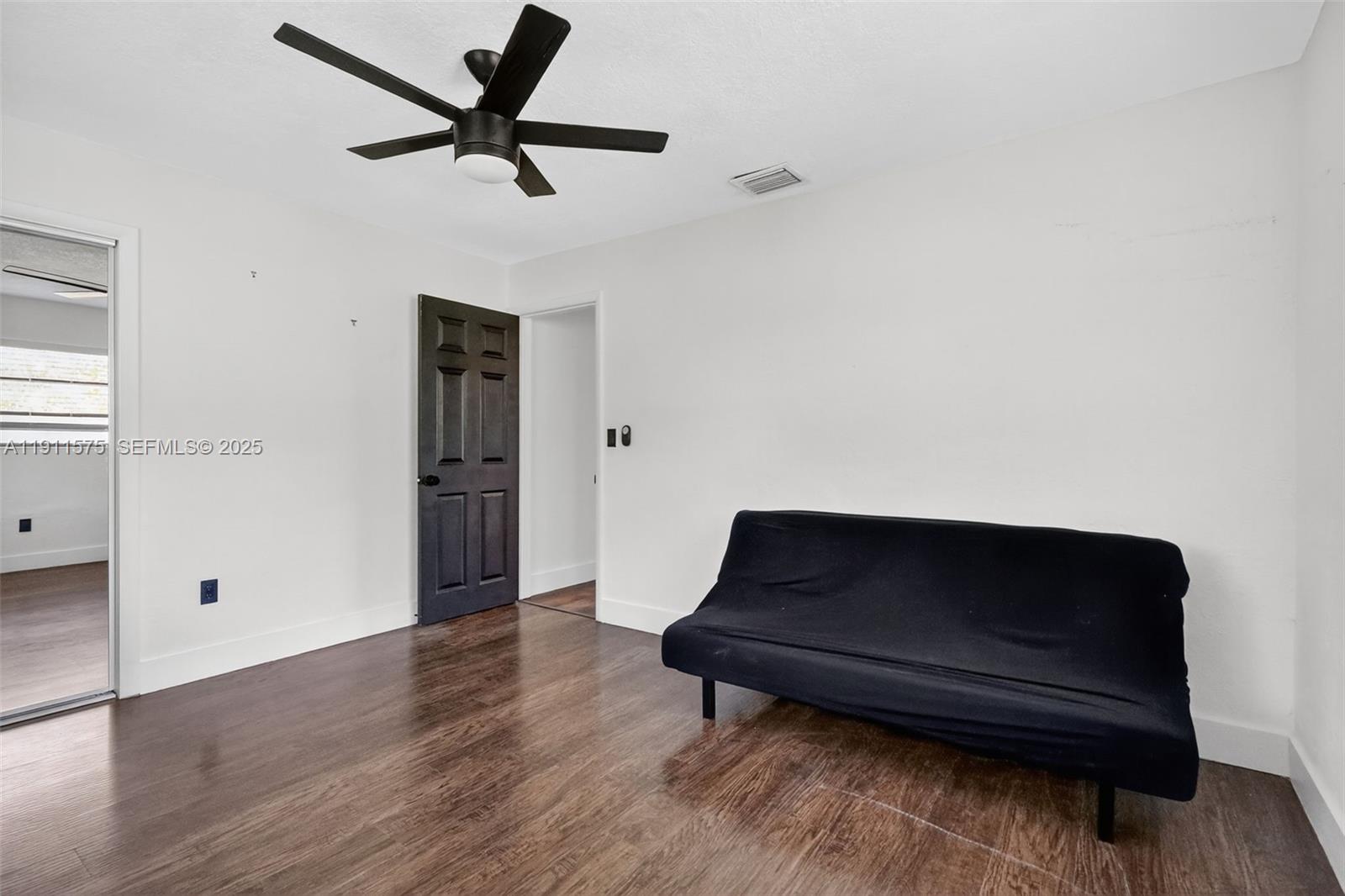 765 Northwest 46th Street Miami, FL 33127 - Photo 31 of 40 a living room with wooden floor