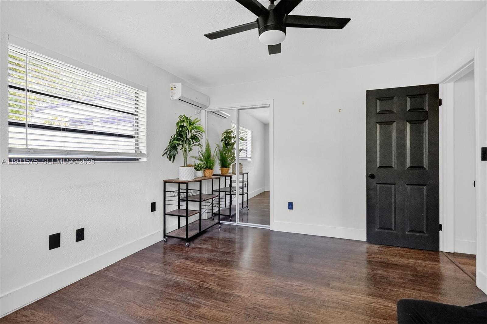 765 Northwest 46th Street Miami, FL 33127 - Photo 32 of 40 wooden floor in an empty room with a window