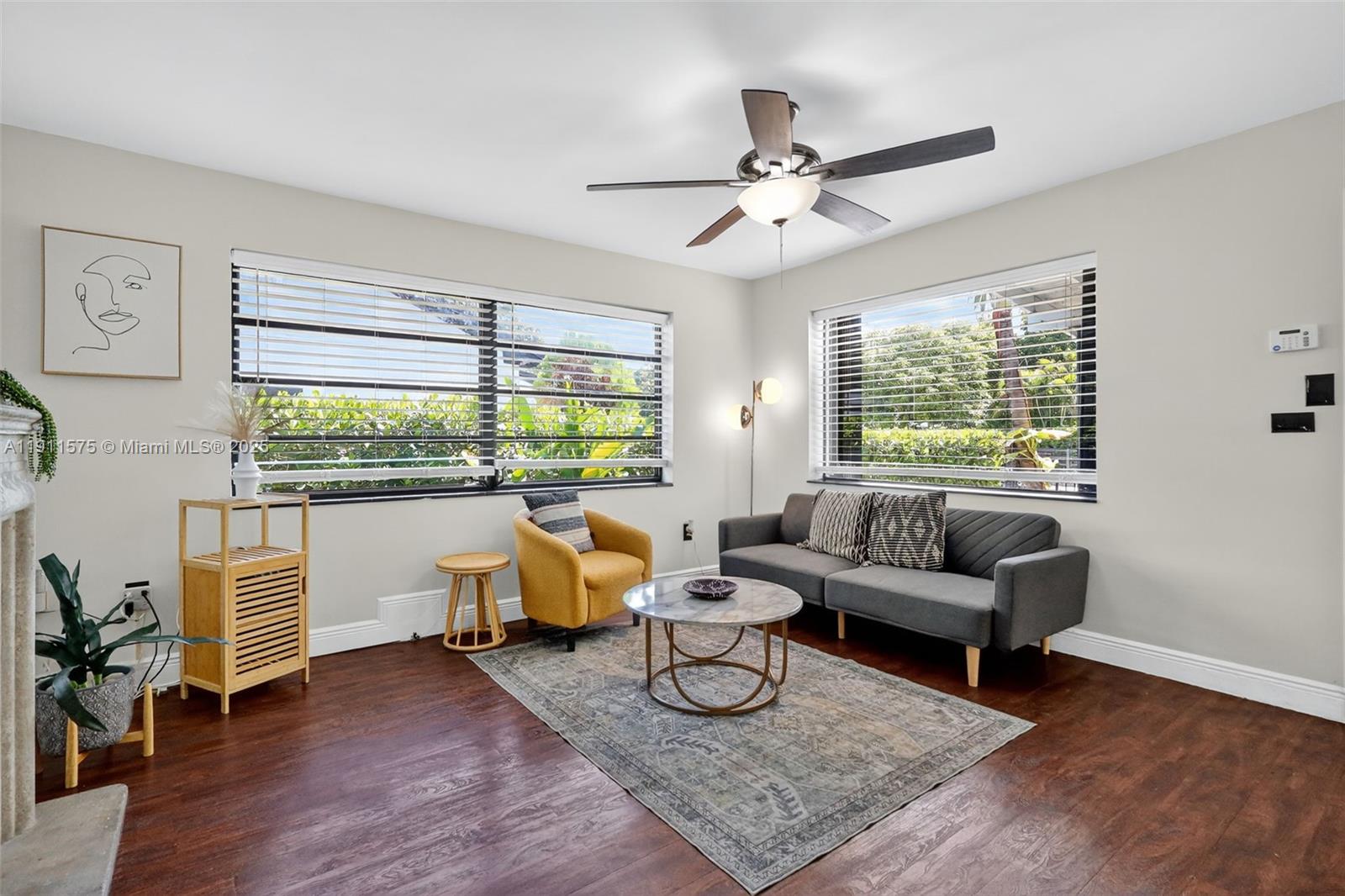 765 Northwest 46th Street Miami, FL 33127 - Photo 5 of 40 a living room with furniture and a window