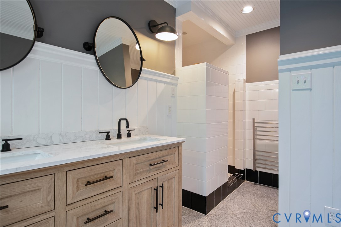 3111 Middlewood Road Midlothian, VA 23113 - Photo 22 of 45 Dual vanity with wood-finish cabinetry, white coun