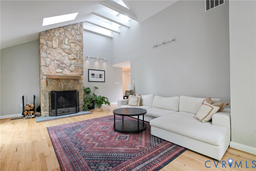 3111 Middlewood Road Midlothian, VA 23113 - Photo 3 of 45 Vaulted ceiling living area featuring a stone-face