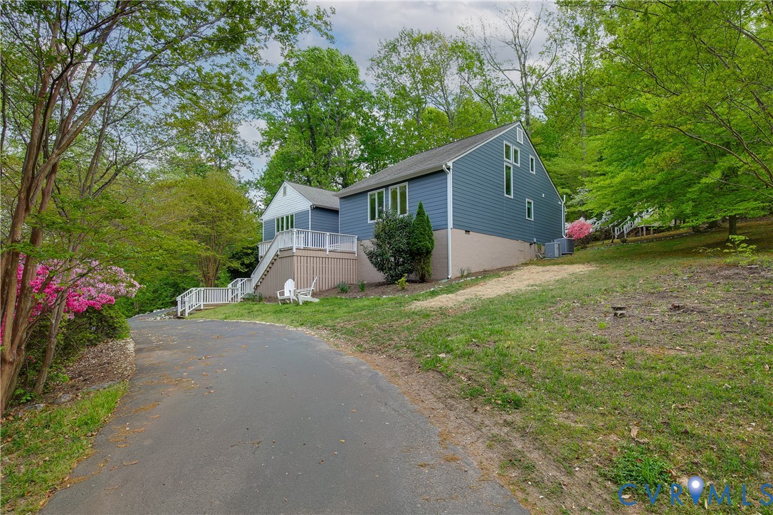 3111 Middlewood Road Midlothian, VA 23113 - Photo 44 of 45 Modern residence featuring blue siding and a light