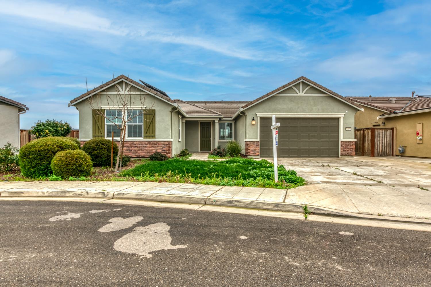 1469 Rinconada Drive Madera, CA 93637 - Photo 2 of 32 a front view of a house with a yard