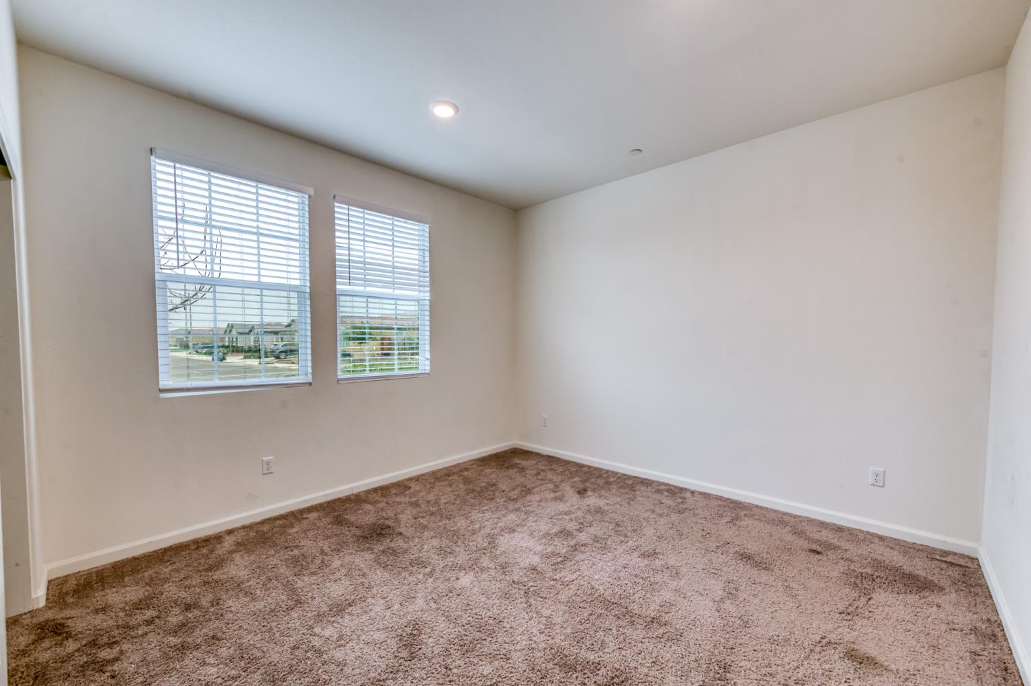 1469 Rinconada Drive Madera, CA 93637 - Photo 21 of 32 an empty room with a window