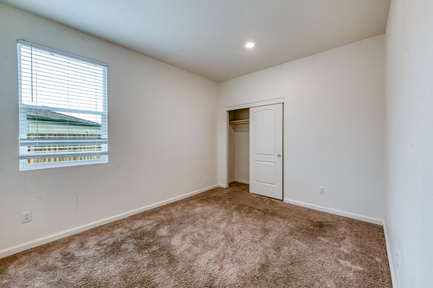 1469 Rinconada Drive Madera, CA 93637 - Photo 24 of 32 an empty room with windows