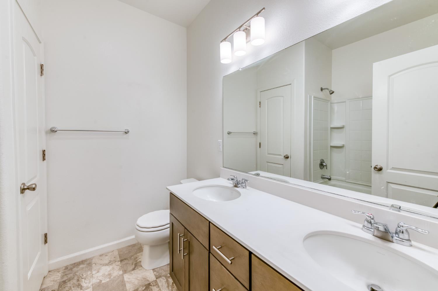 1469 Rinconada Drive Madera, CA 93637 - Photo 25 of 32 a bathroom with a sink a toilet and shower