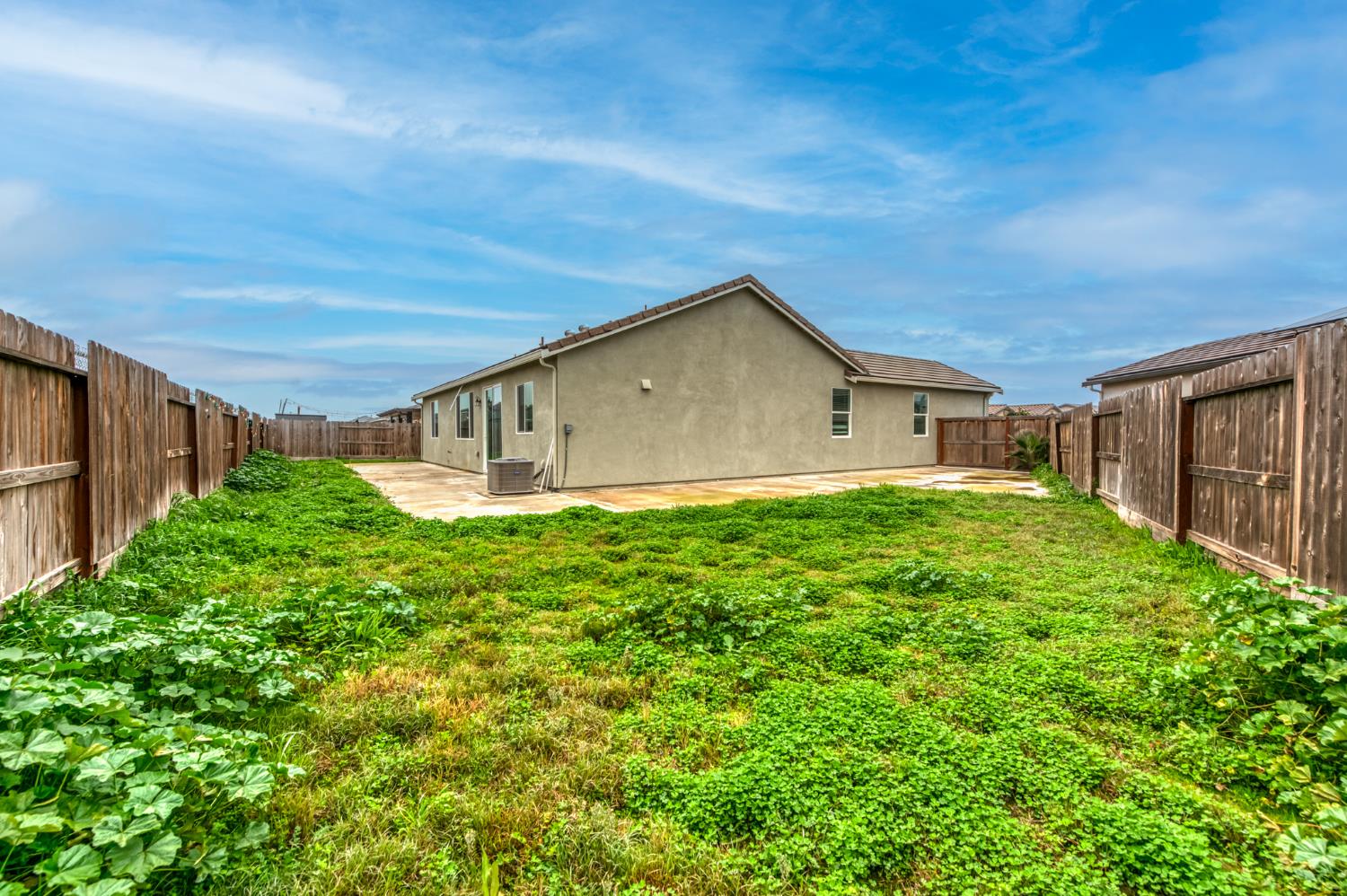 1469 Rinconada Drive Madera, CA 93637 - Photo 32 of 32 a view of a house with backyard and garden