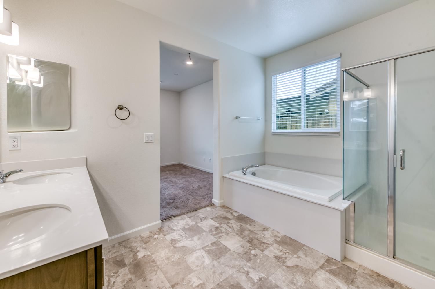 1469 Rinconada Drive Madera, CA 93637 - Photo 5 of 32 a bathroom with a sink a toilet and shower