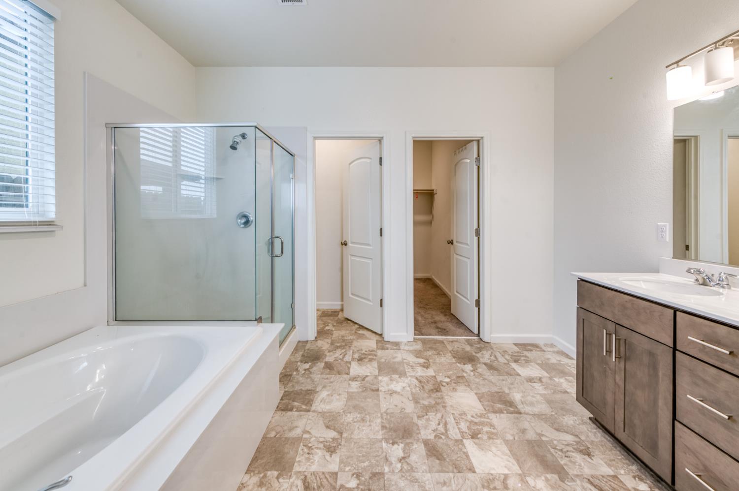 1469 Rinconada Drive Madera, CA 93637 - Photo 8 of 32 a spacious bathroom with a tub shower and sink