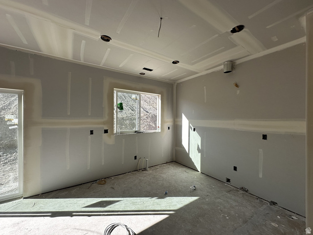 513 East Upper Cyn Road Smithfield, UT 84335 - Photo 19 of 25 Unfinished interior space featuring drywall installation, recessed lighting preparations, and a large window