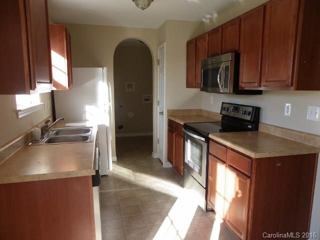 720 Jones Branch Road Fort Mill, SC 29715 - Photo 4 of 12 a kitchen with a sink a stove and cabinets