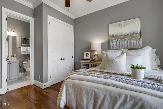 a bedroom with a bed and a painting