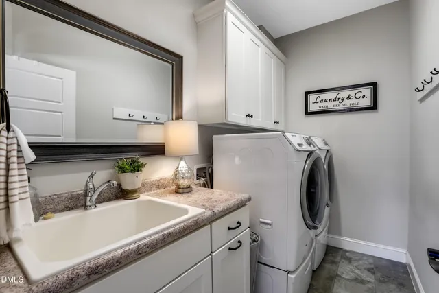 a bedroom with a bed and a dresser in it