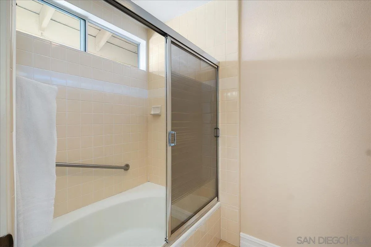 17526 St Andrews Drive Poway, CA 92064 - Photo 11 of 55 a bathroom with a bathtub and a shower