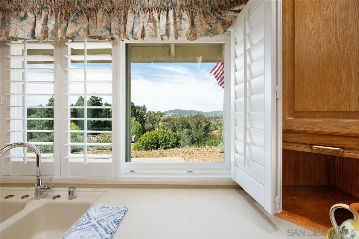 17526 St Andrews Drive Poway, CA 92064 - Photo 19 of 55 a view of a bathroom with a tub and window
