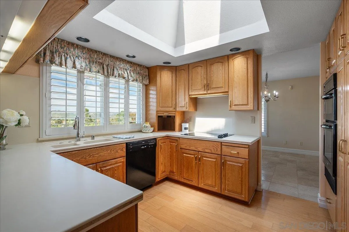 17526 St Andrews Drive Poway, CA 92064 - Photo 20 of 55 a kitchen with stainless steel appliances granite countertop a sink and a stove